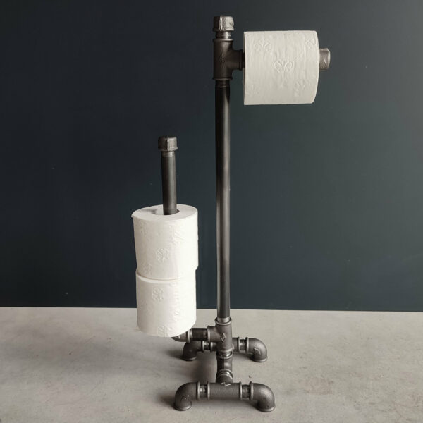 Toilet paper holder on plumbing pipe stand - MC Fact